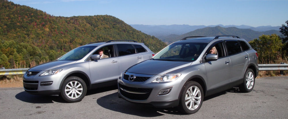 RoadRunner Driving Service - Two cars parked with mountain scenery